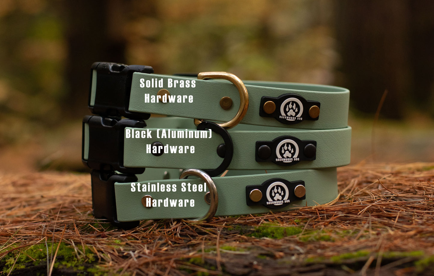 Stack of green dog collars with different hardware options on a natural background